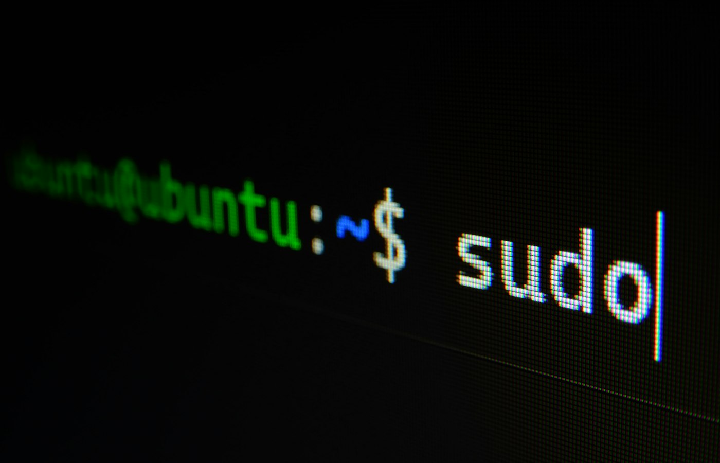 A terminal prompt reading sudo glowing on an otherwise black screen